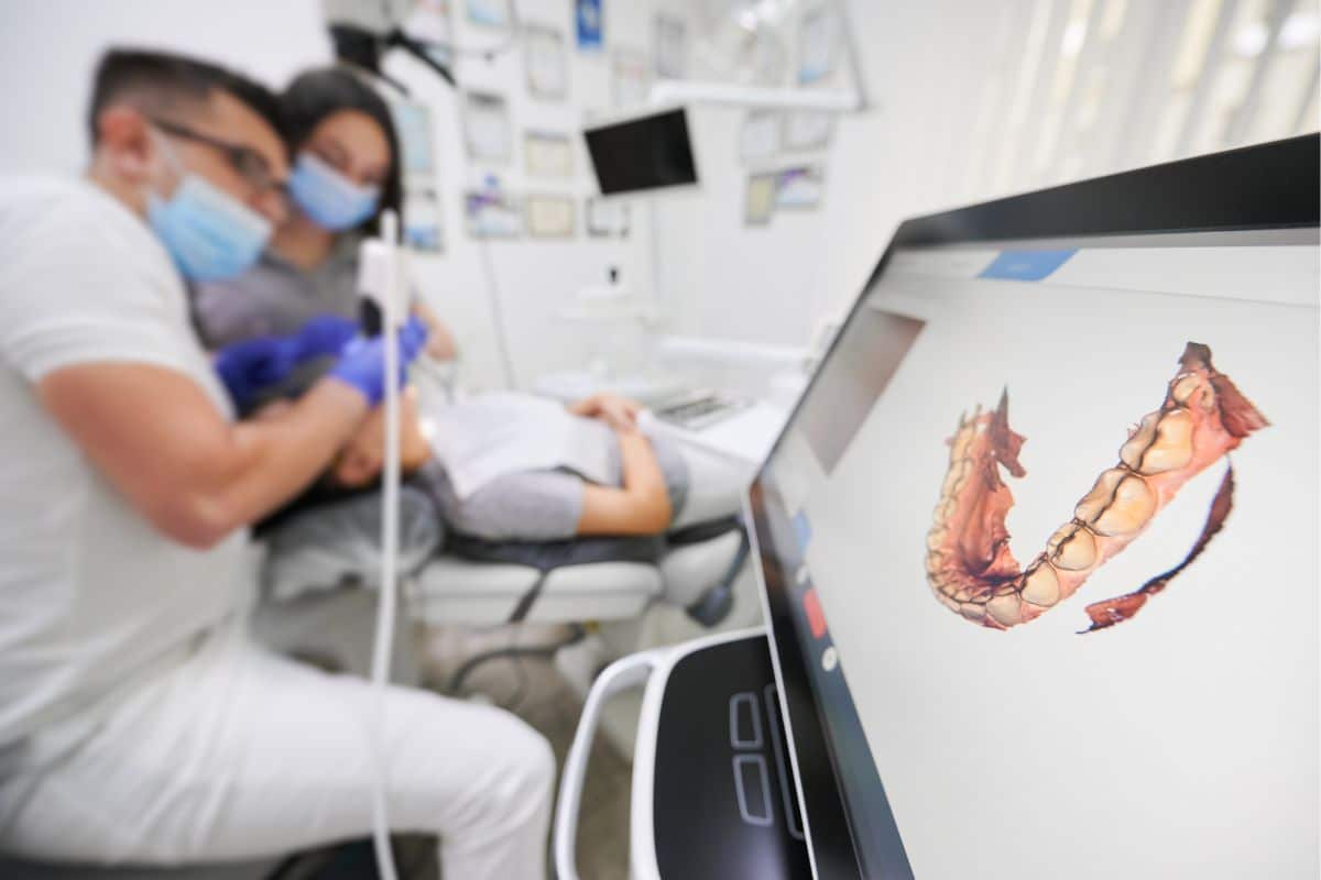 Orthodontist performing a first Invisalign digital scan during a consultation in Southlake, TX.